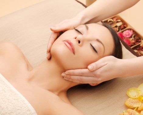 woman in spa salon lying on the massage desk